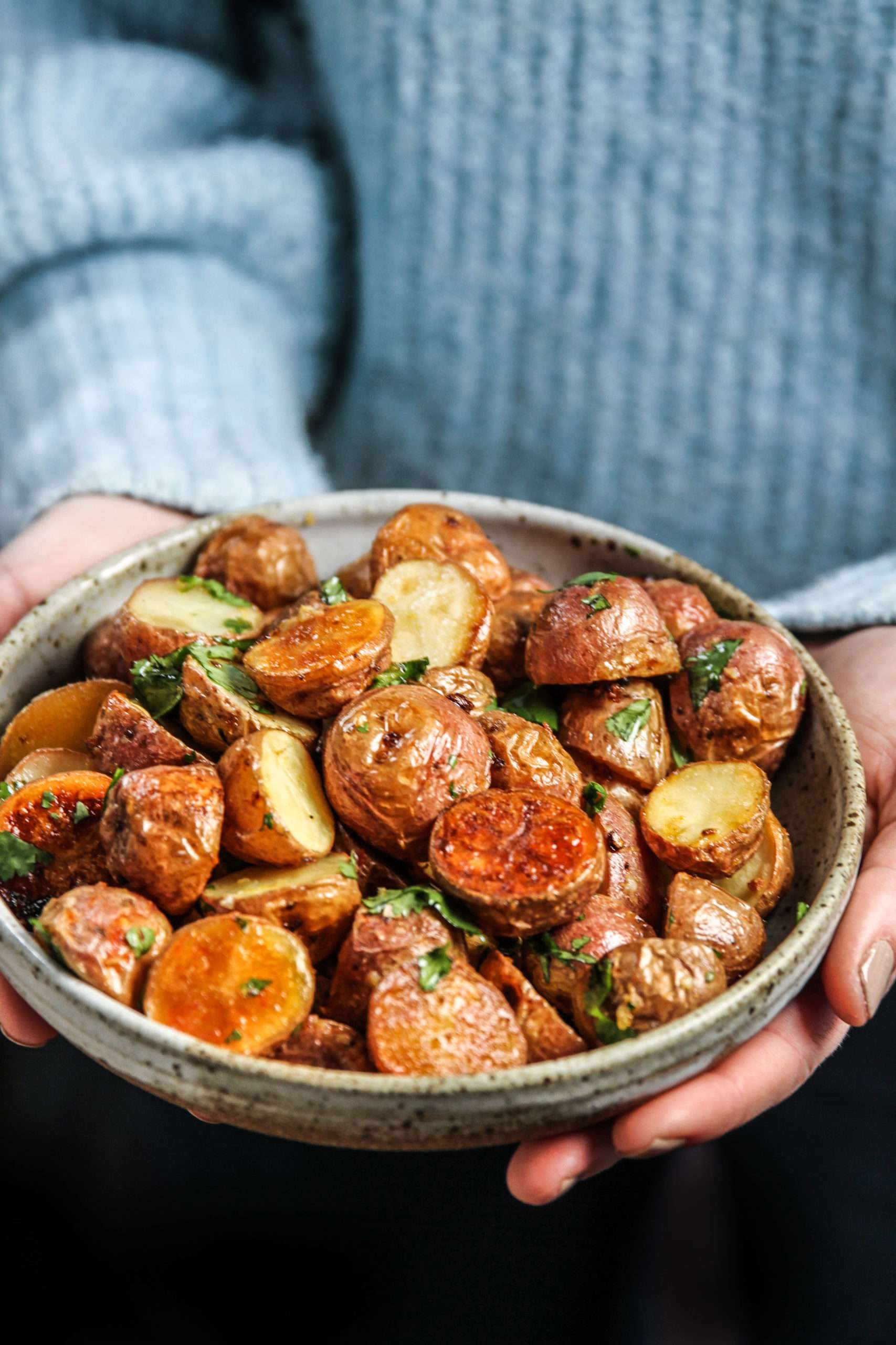 Roasted potatoes held in a serving bowl