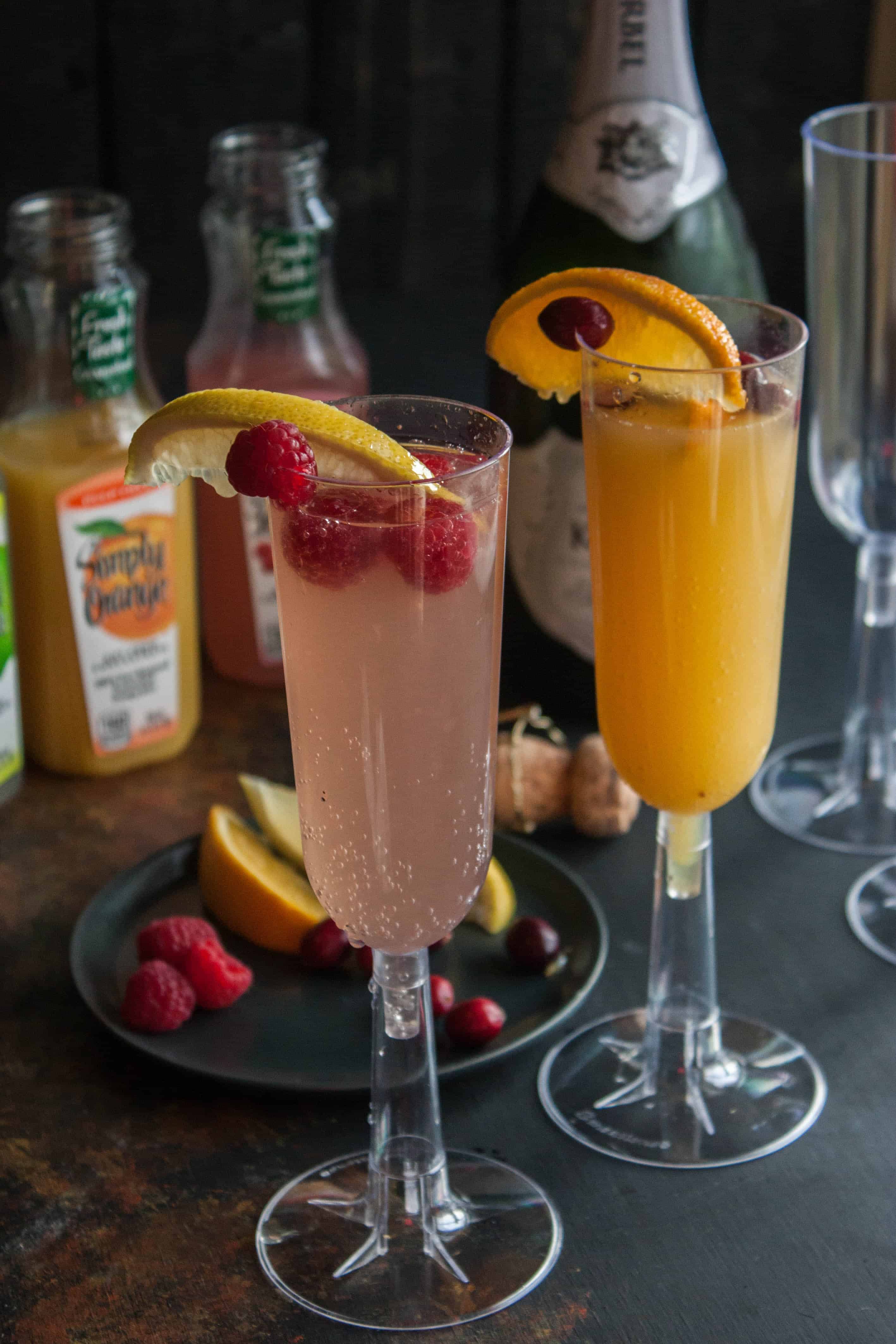 2 champagne flutes with mimosas for a mimosa bar