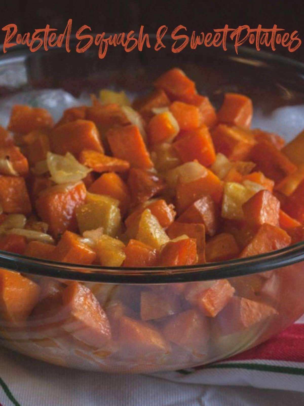 Roasted squash and sweet potatoes in a glass bowl