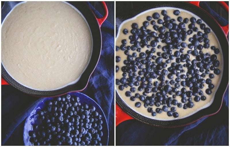 Cake batter in a pan with blueberries