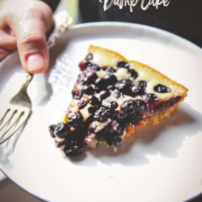 Blueberry skillet dump cake slice on a white plate
