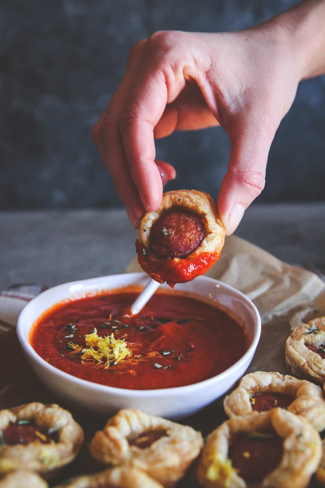 Dipping appetizer bite into sauce