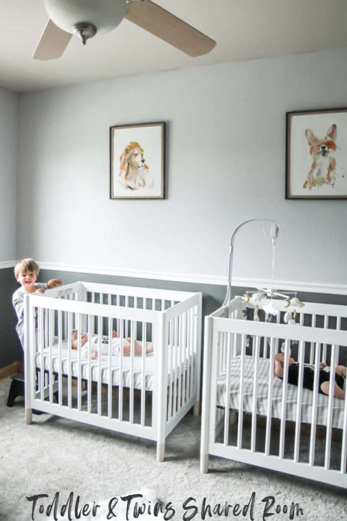 twin bed and crib in small room