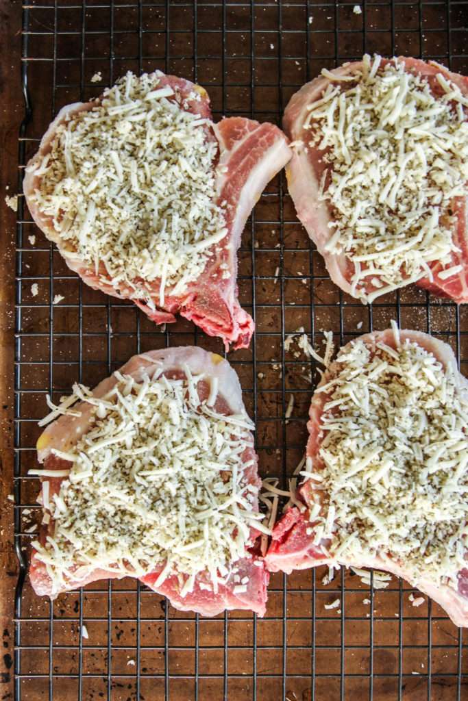 Bone in pork chops with a cheesy crunchy topping