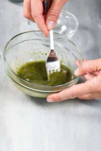 Mixing seasonings in small glass bowl
