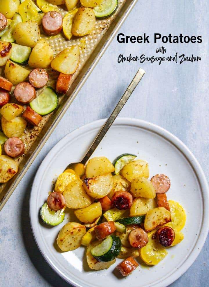 Greek potatoes, chicken sausage and zucchini on a plate