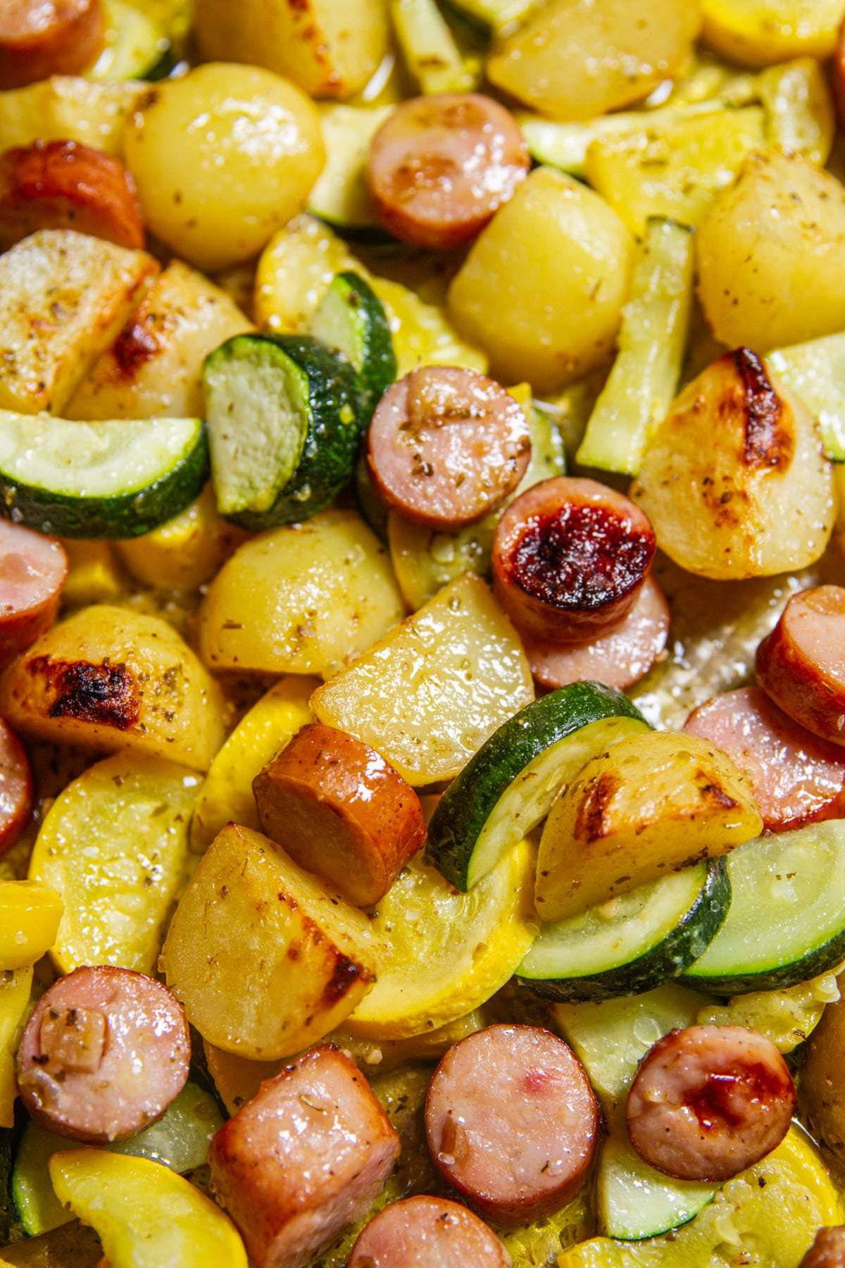 Close up of chicken sausage, zucchini and potatoes