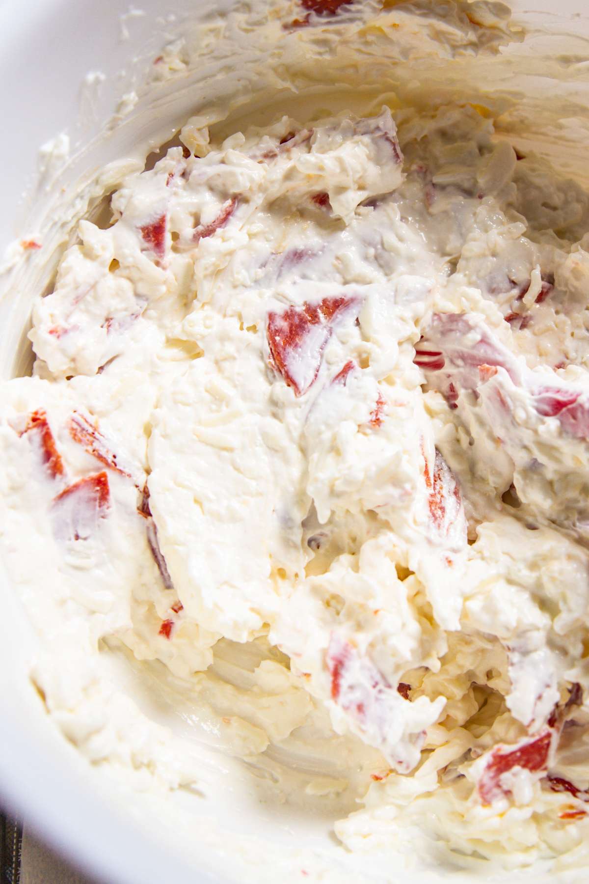 Pepperoni dip being mixed in bowl