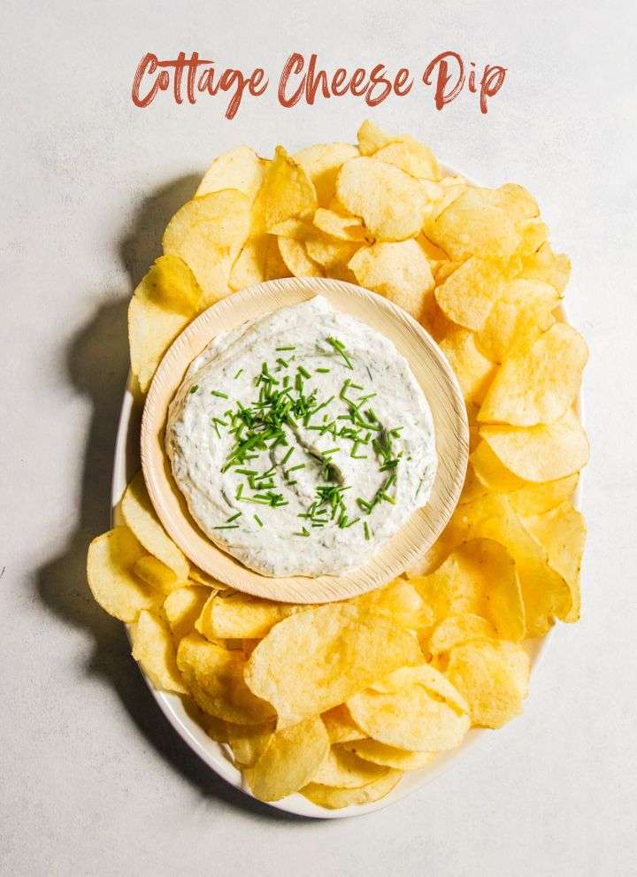 Cottage cheese dip with chips on an oval platter